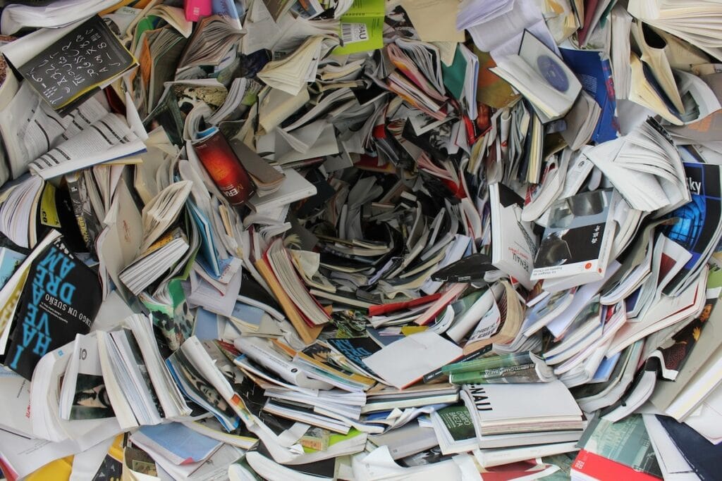 Spiral of scattered open books and magazines